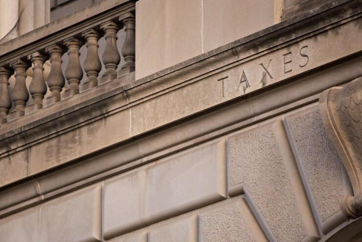 The word "Taxes" is seen on the facade of the Internal Revenue Service headquarters in Washington, D.C.