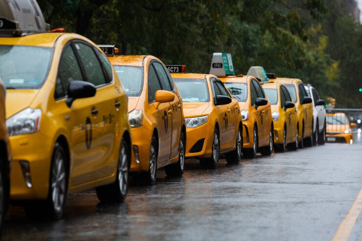 Taxis lined up in a row on the street