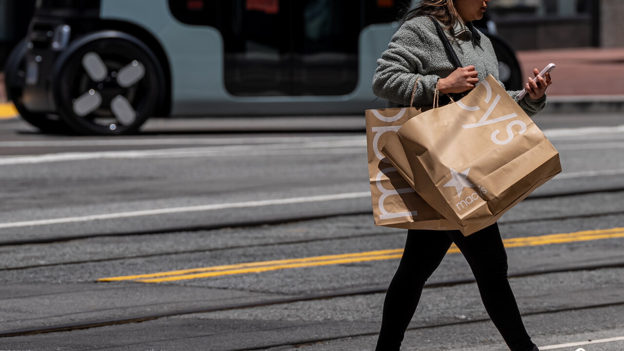 A picture of a shopper on Market Street in San Francisco.
