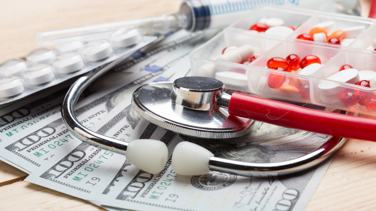 Medical supplies on top of a fan of money