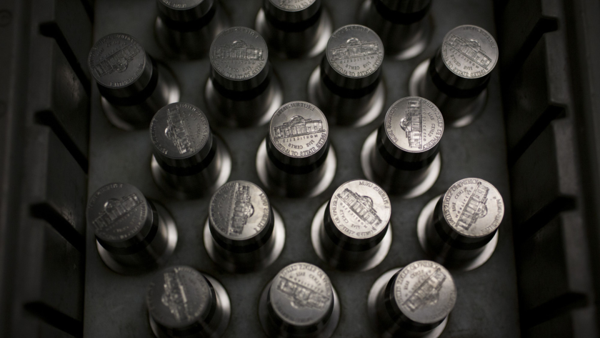 Coins. Specifically, dies used for pressing nickels sit in a tray in Pennsylvania