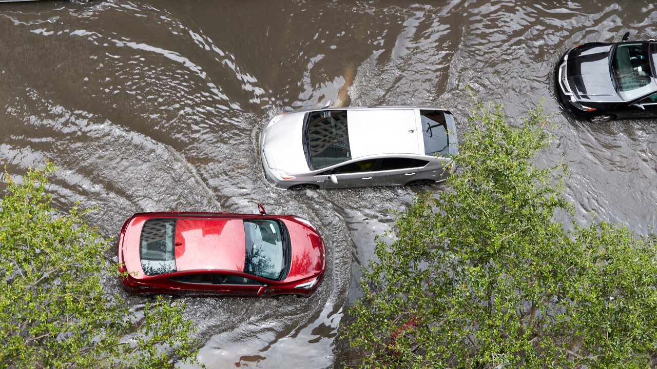 Cars on a flooded road.