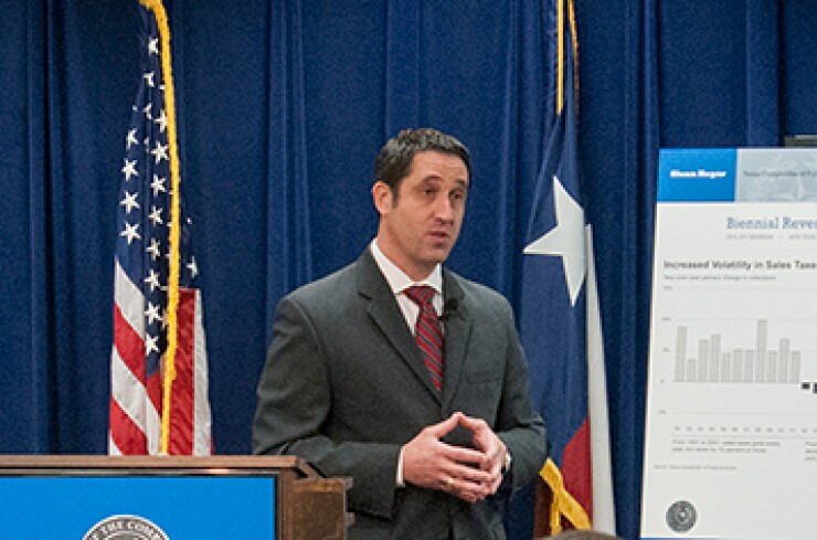 hegar-glenn-at-podium.jpg