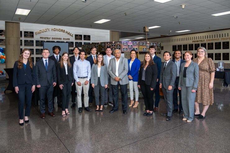 Students at the University of Texas at Austin's McCombs School of Business posed in 2024 around Ramesh K.S. Rao, the founding director of the school's Langston Wealth Management Center and Candace and John Langston of Republic Capital Group, the wealth management investment bankers whose gifts to the university launched a fellowship program in 2022 and, two years later, the Langston Wealth Management Center.