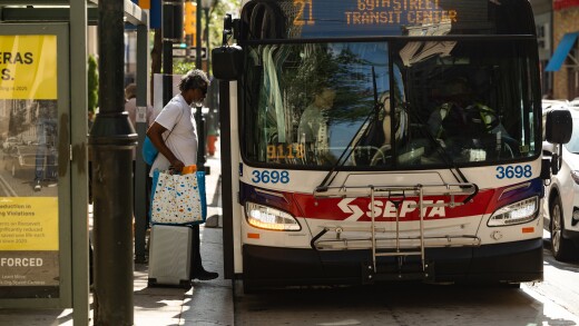 A commuter boards a SEPTA bus in Philadelphia.