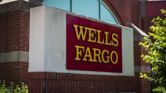 Signage is displayed outside a Wells Fargo & Co. bank branch in Schaumburg, Illinois, U.S., on Tuesday, July 10, 2018. Wells Fargo & Co. is scheduled to release earnings figures on July 13. Photographer: Christopher Dilts/Bloomberg