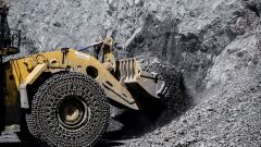 A front loader scoops up freshly blasted rock containing iron ore at the Yeristovo and Poltava iron ore mine, operated by Ferrexpo Poltava Mining PJSC, in Poltava, Ukraine.
