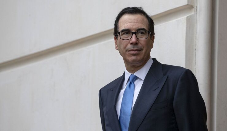 Treasury Secretary Steven Mnuchin waits outside the Office of the U.S. Trade Representative in Washington, D.C.