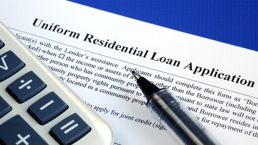 File the mortgage application isolated on blue