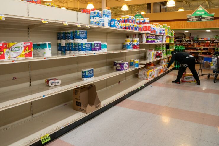 A customer shops for paper towels at a supermarket in Trenton, New Jersey, U.S., on Monday, March 16, 2020. All New Jersey schools must close starting March 18 for at least two weeks as state officials try to slow the spread of the new coronavirus, Governor Murphy said. Photographer: David 'Dee' Delgado/Bloomberg