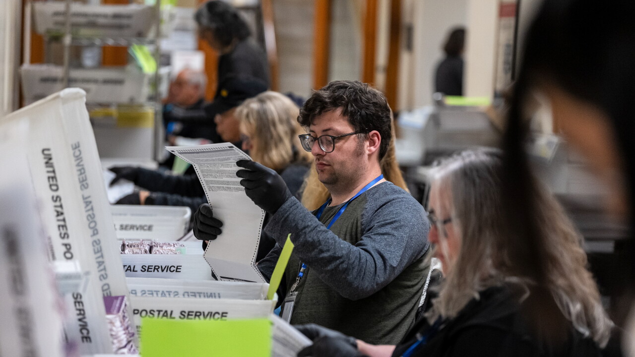 California election workers sort mail-in ballots during the June 2 primary.