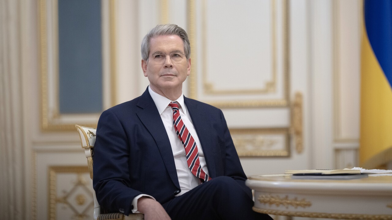 Treasury Secretary Scott Bessent seated in an ornate room