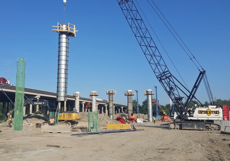 Illinois State Toll Highway Authority work to construct the new northbound I-294 Mile Long Bridge structure near Willow Springs in August 2019.