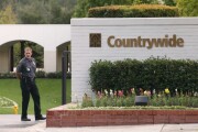 A security guard stands outside the Countrywide Financial Corp. headquarters in Calabasas, California on Wednesday, October 20, 2004.