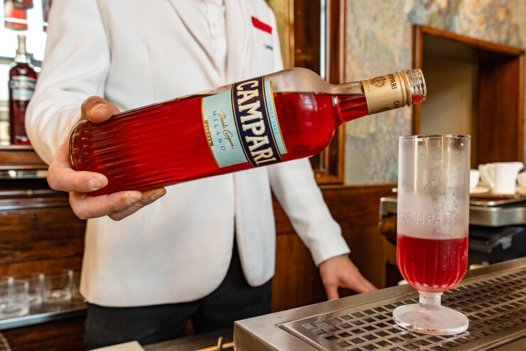A bartender prepares a Campari Seltz cocktail at the Camparino in Galleria, in Milan, Italy.