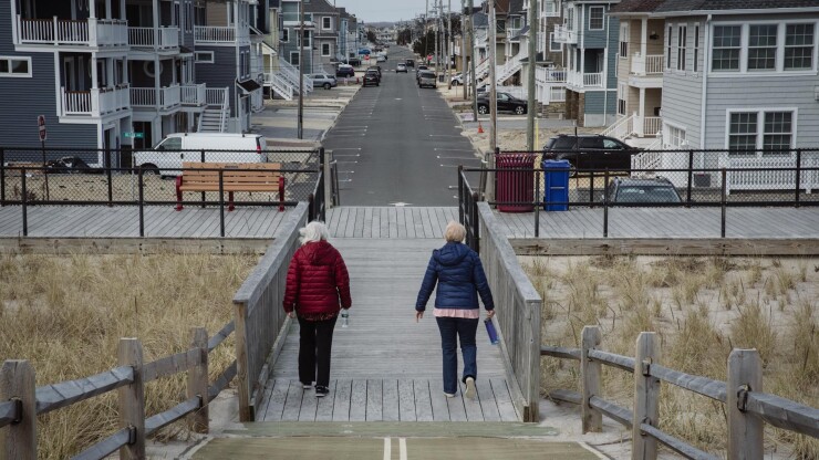 Two people walking in Toms River, New Jersey