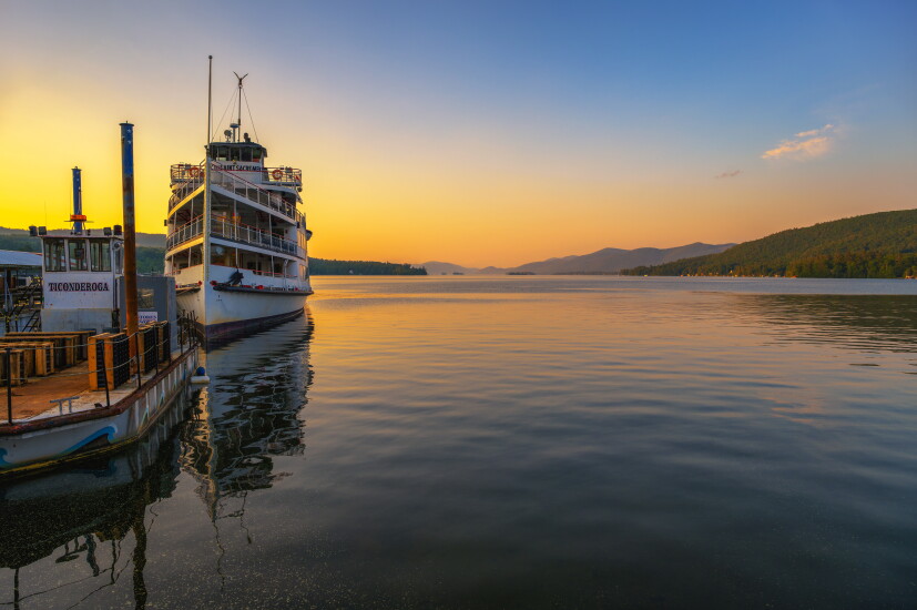 Tour Boat on Lake George at Sunset, with Adirondack Mountains in New York State
