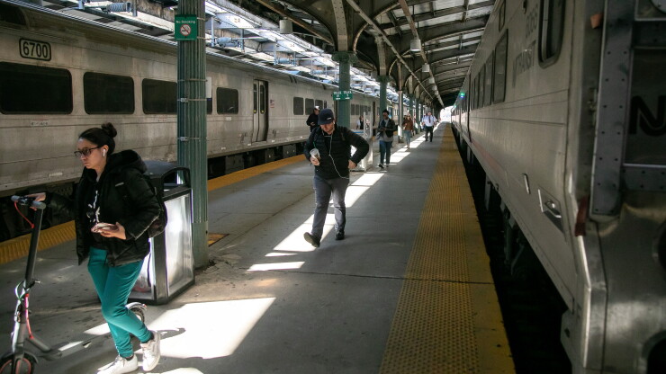 New Jersey transit trains and passengers in a station
