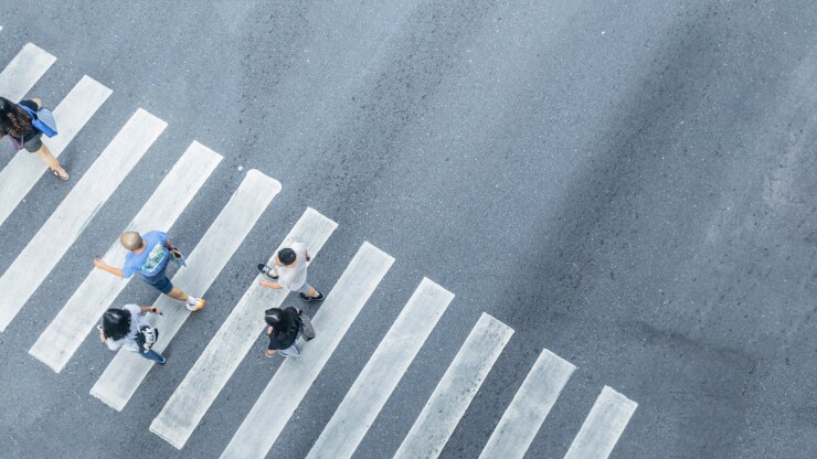 An aerial view of walking through a crosswalk