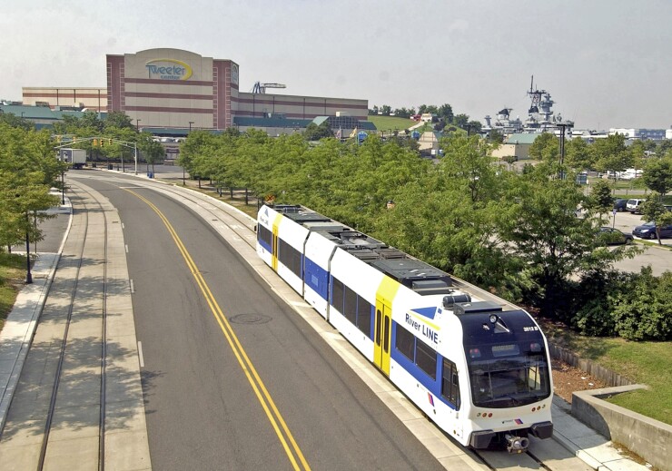 A New Jersey Transit River Line train approaches in Camden, New Jersey, on Friday, July 22, 2005.