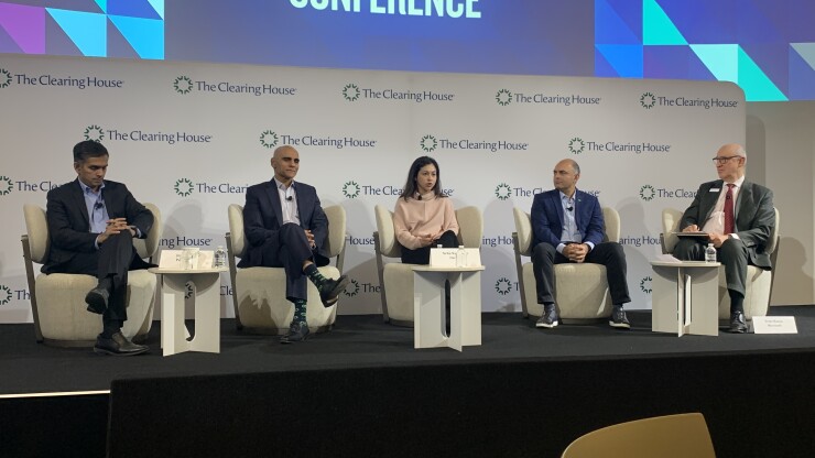 Speakers on stage during a panel regarding artificial intelligence usage across the financial services industry held on Nov. 16 at The Clearing House's annual conference in New York.