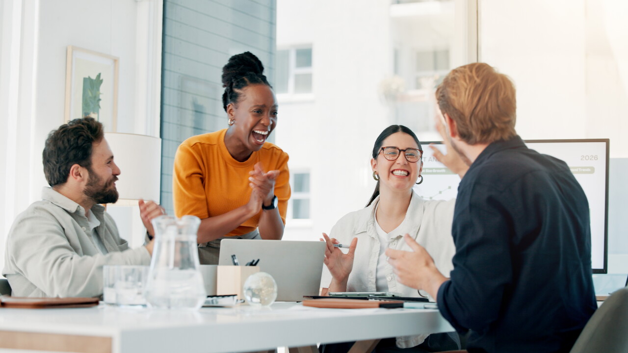 Smiling employees in a conference room