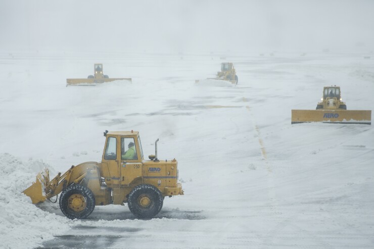 Clearing up after Stella at LaGuardia Airport