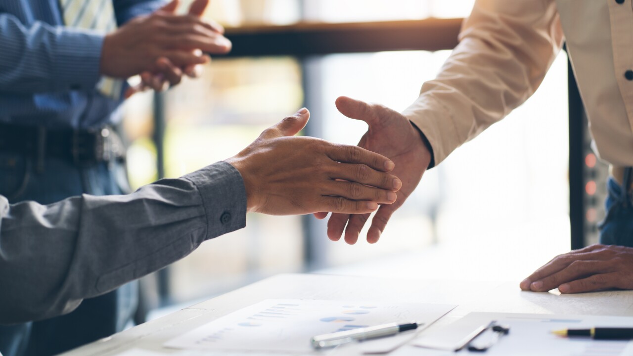 Merchants Bancorp said it reached deals with two banks to sell a total of four branches in Illinois.