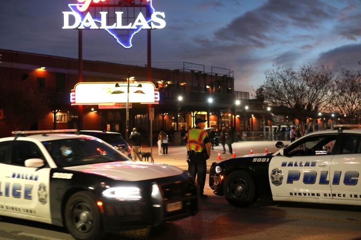 Dallas police officers and police cars