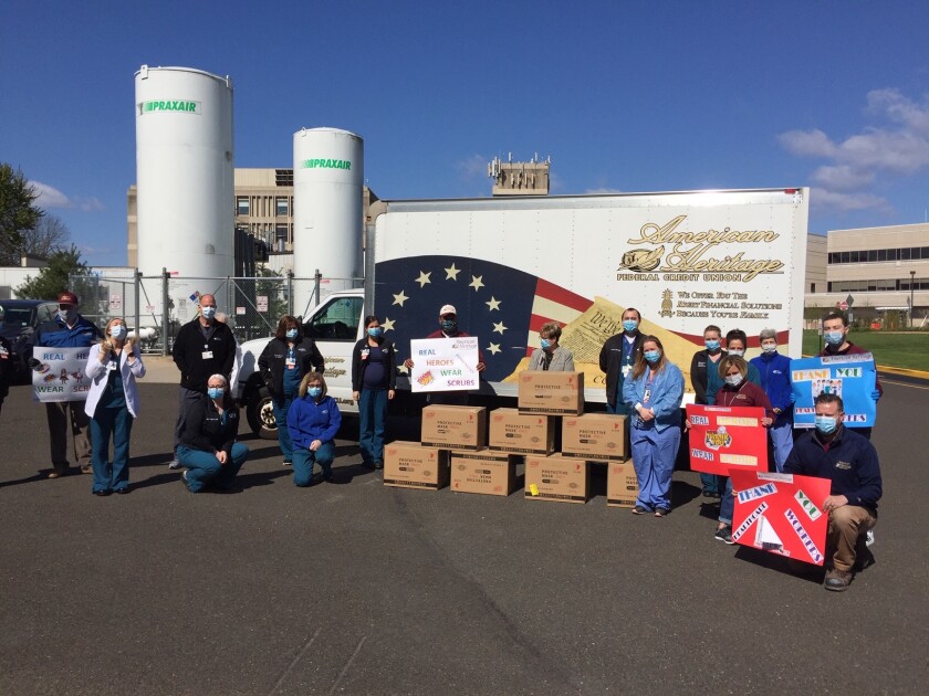 Heritage Federal Credit Union employees deliver personal protective equipment to a local hospital.