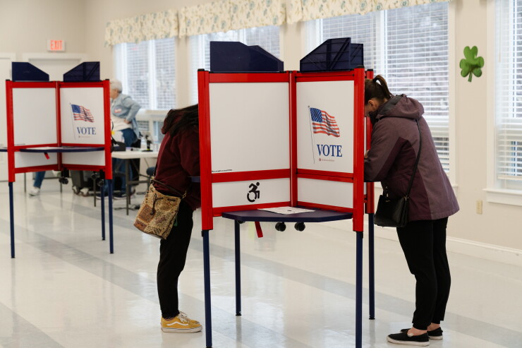 Massachusetts voters mark their ballots