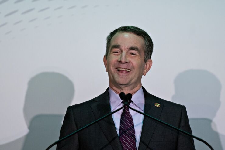Ralph Northam, governor of Virginia, smiles while speaking during a news conference in Arlington, Virginia on Tuesday, Nov. 13, 2018.