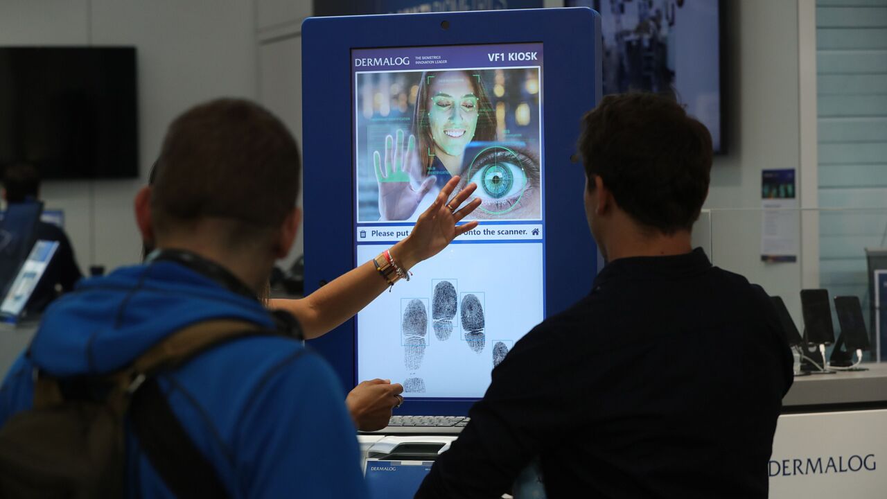 A screen displays iris, facial and fingerprint recognition technology on the Dermalog GmbH exhibition stand at the CeBIT 2018 tech fair in Hanover, Germany, on Monday, June 11, 2018. CeBIT, Europe's business festival for innovation and digitization, runs June 11 - 15. Photographer: Krisztian Bocsi/Bloomberg