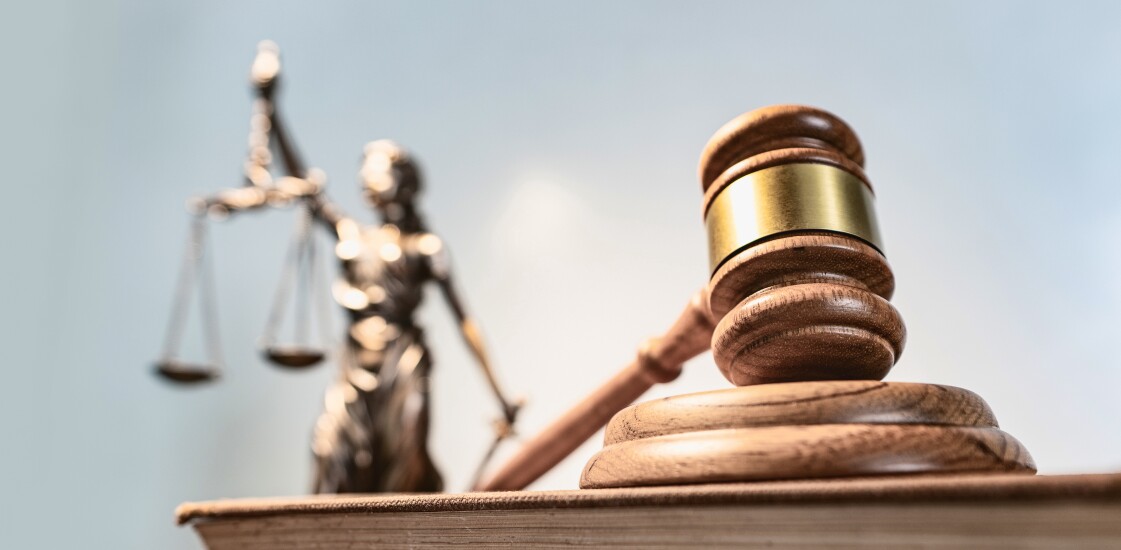 Statue of lady justice on bright background - Side view with cop