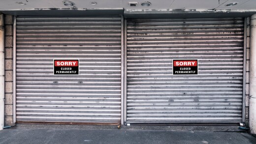 Two closed corrugated metallic Roll up doors with closed permane