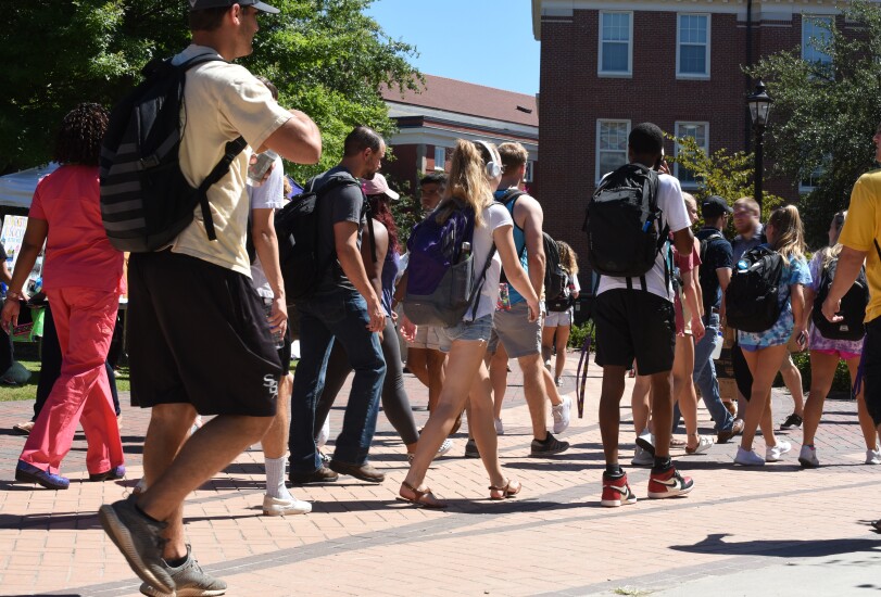 College students walking across campus