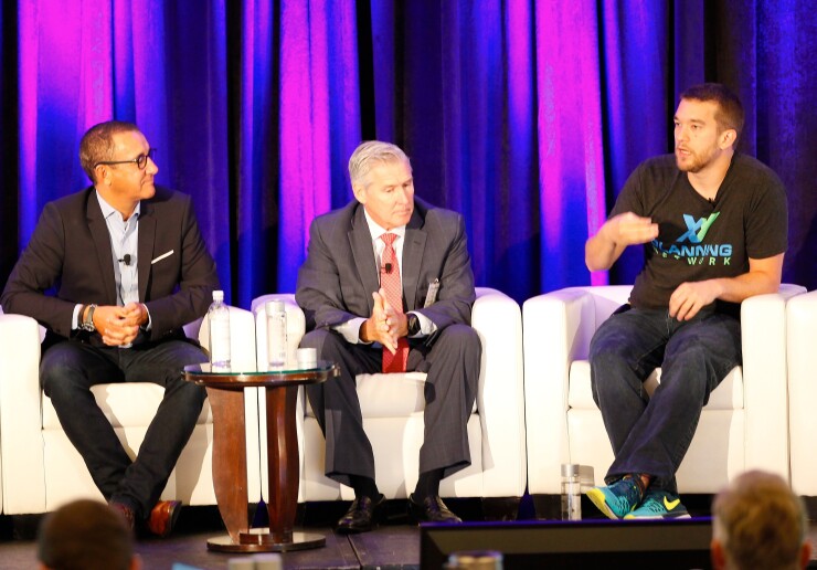 XY Planning Network co-founder Alan Moore, far right, said many young advisors "would be thrilled to earn $100,000 a year."