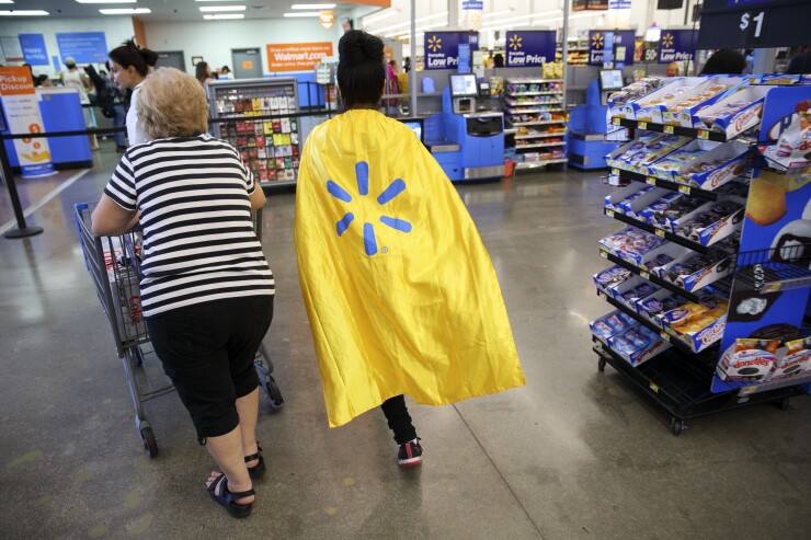 Walmart employee wearing a cape