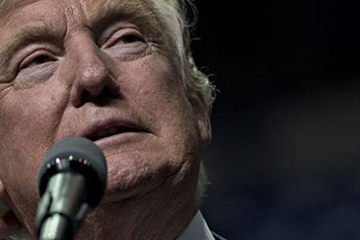 President-elect Donald Trump speaking into a microphone.