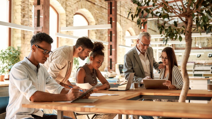 Employees working together in office