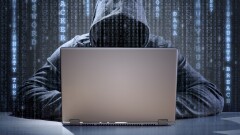 Hooded computer hacker.