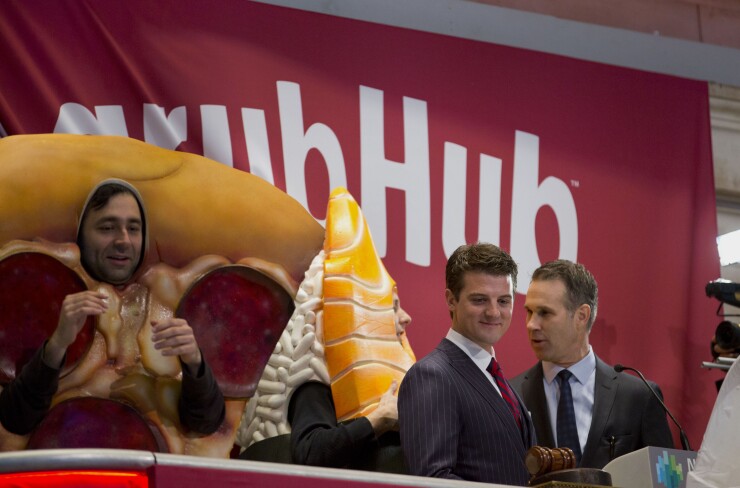 Matt Maloney, co-founder and chief executive of GrubHub Inc., second from right, gets ready to ring the opening bell on the floor of the New York Stock Exchange in 2014.