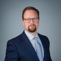 Headshot of EXL's Karl Canty.