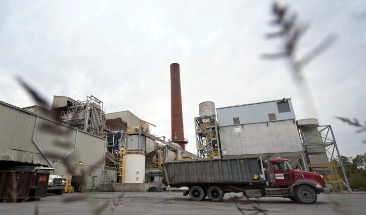 Trucks sit parked outside of the municipal waste-to-energy incinerator facility in Harrisburg, Pennsylvania, U.S., on Friday, Oct. 28, 2011.
