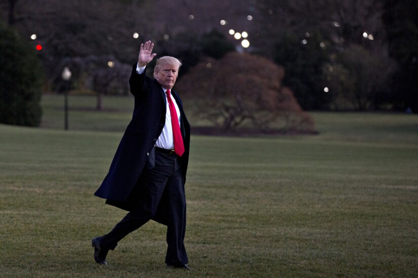 President Donald Trump waving to camera