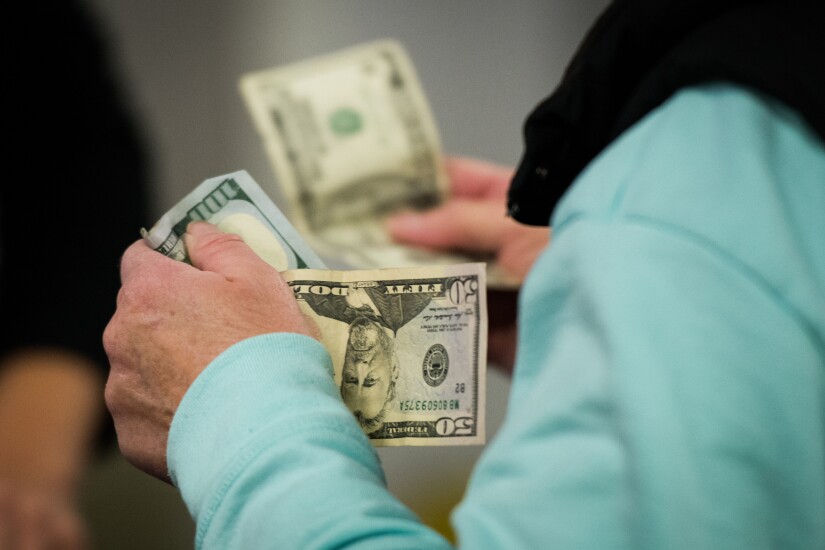 Money-shopping-cash-black-friday-bloomberg