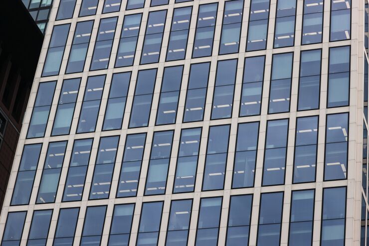 Office windows at the Taunustor skyscraper office property in the financial district in Frankfurt, Germany.