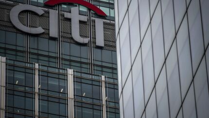 A sign sits on top of the skyscraper housing the Citigroup Inc. offices at 25 Canada Square in the Canary Wharf business, financial and shopping district in London, U.K.