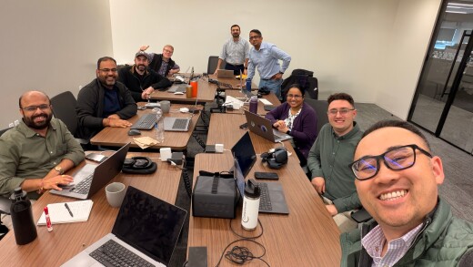 Fiserv developers sitting around a table