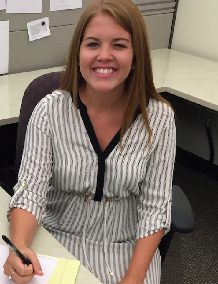 Mary Moore, then Carroll, at work on the day she says she was sexually assaulted at a nighttime industry gathering.